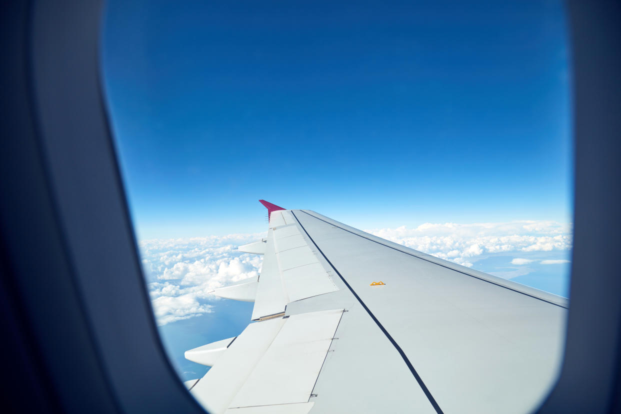 Airplane wing as seen from the passenger's seat.