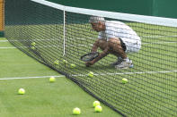 Mayor of London Sadiq Khan plays tennis with key workers at the All England Lawn Tennis Club in Wimbledon, south west London, during an event to thank members of the NHS, TfL and care workers for their service during the coronavirus pandemic.