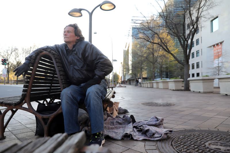 Goshorn prepares to bed down for the night during the coronavirus pandemic, on Pennsylvania Avenue in Washington