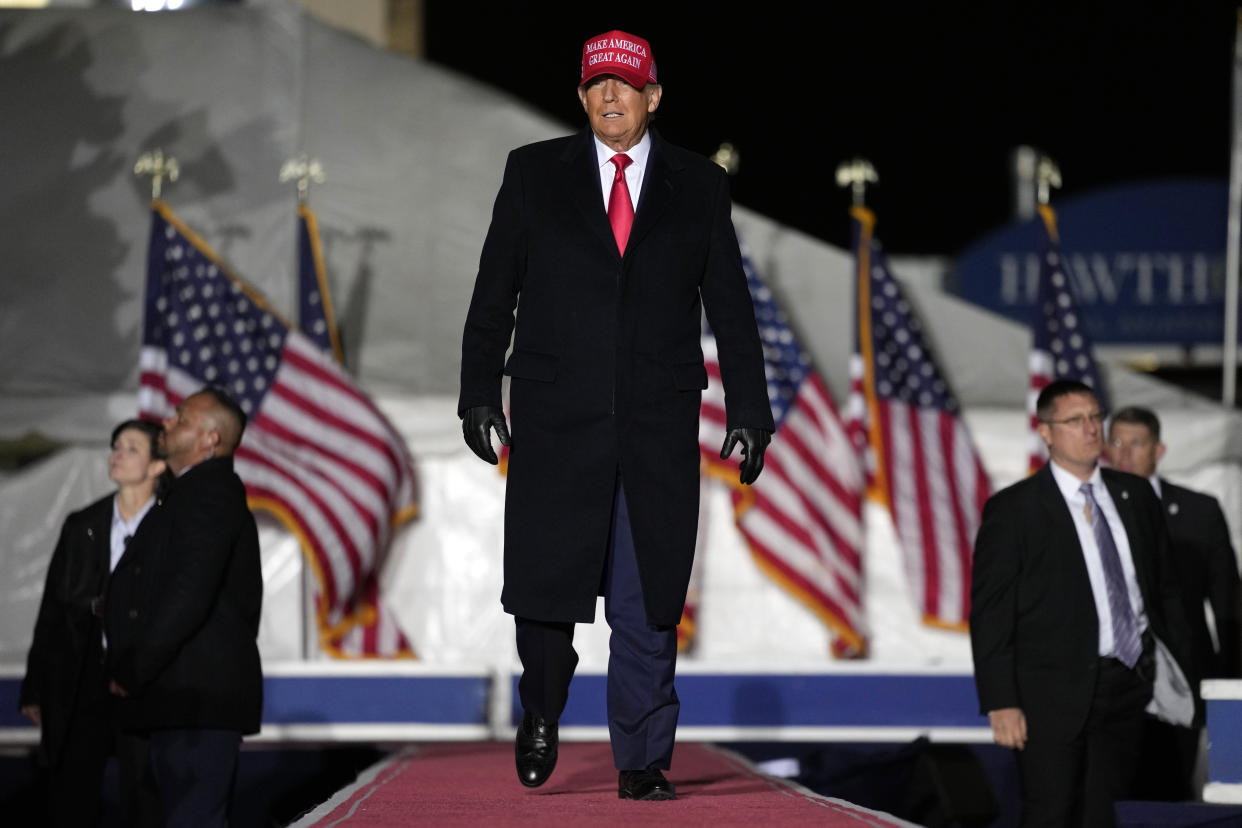 Former President Donald Trump arrives at a rally, Thursday, Nov. 3, 2022, in Sioux City, Iowa. (AP Photo/Charlie Neibergall)