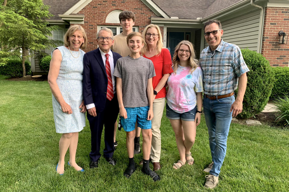 Vax-a-Million winner scholarship Joseph Costello, center, with his family and Ohio Gov. Mike DeWine and his wife, left. (Office of Ohio Governor)