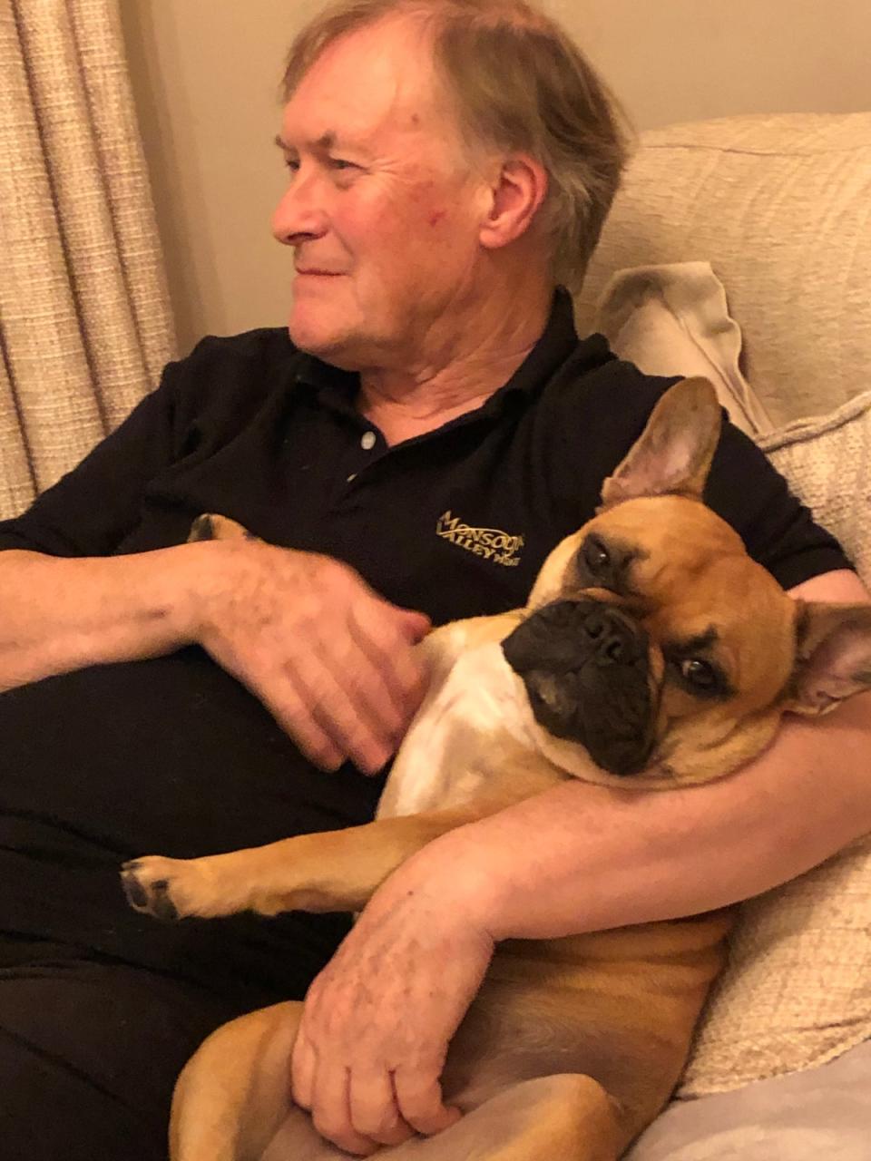 Sir David Amess sits with his Bulldog, Vivienne (Family handout)