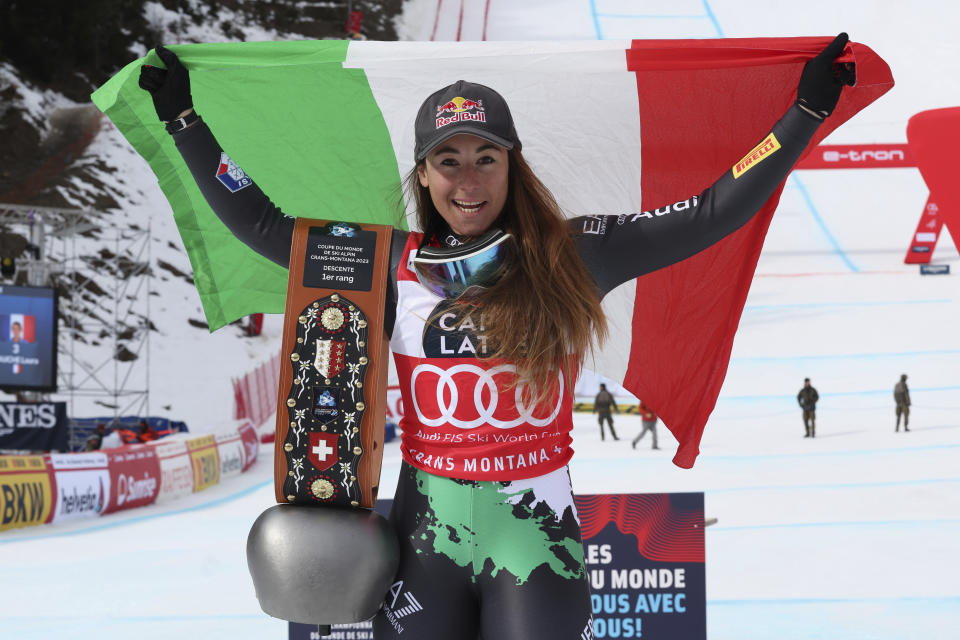 Italy's Sofia Goggia celebrates after winning an alpine ski, women's World Cup downhill race in Crans Montana, Switzerland, Sunday, Feb. 26, 2023. (AP Photo/Alessandro Trovati)