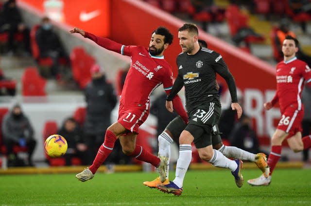 Liverpool’s Mohamed Salah and Manchester United’s Luke Shaw battle for the ball. 