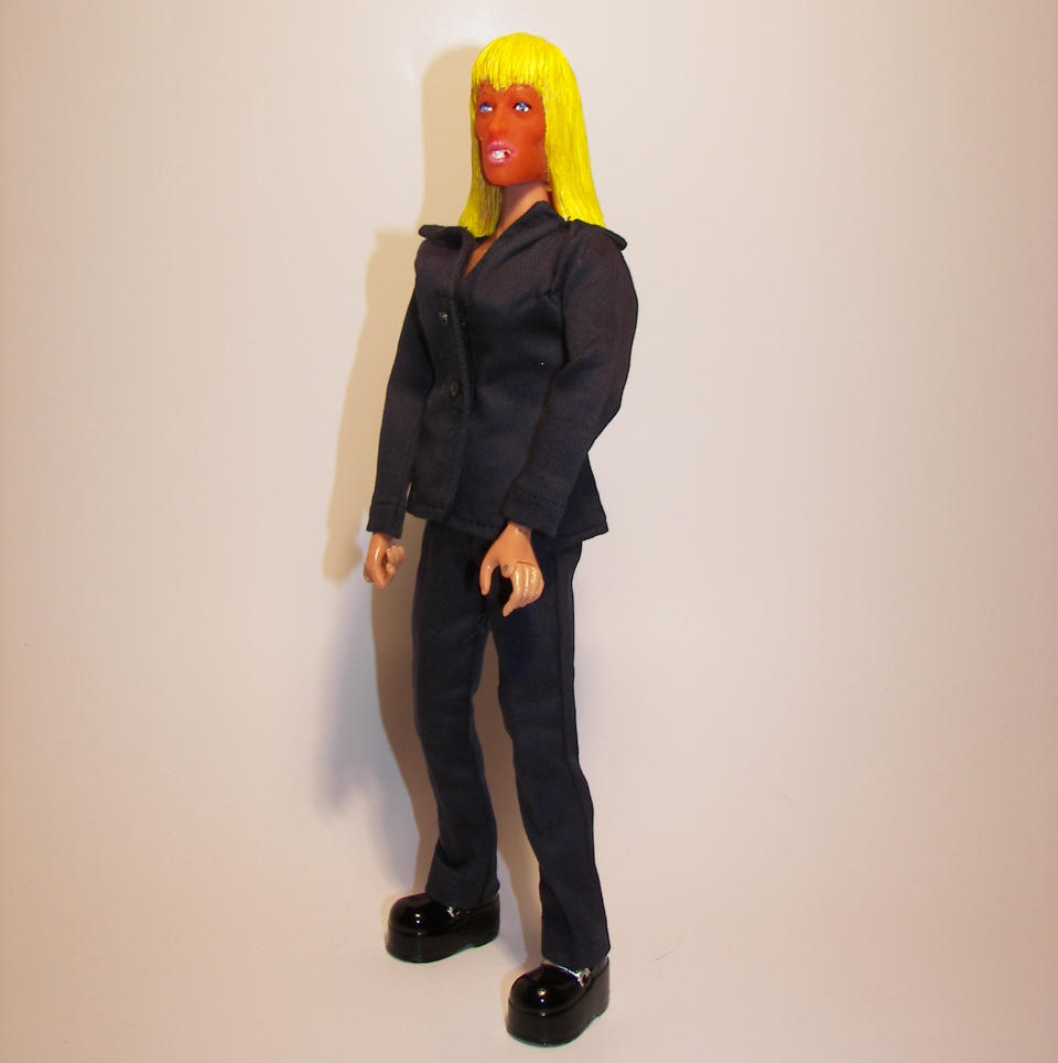 This undated photo provided by HeroBuilders shows the novelty company's new "tanorexic" action figure based on Patricia Krentcil, the deeply tanned New Jersey mother accused of causing skin burns to her young daughter in a tanning booth. (AP Photo/HeroBuilders)