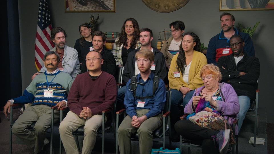 The fake jury of "Jury Trial" with James Marsden sitting next to Richard Gladden in the second row.