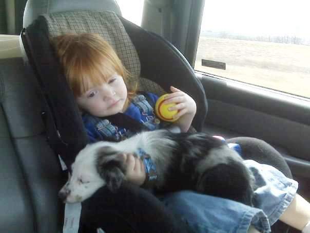 Willow Toft as a toddler, hanging on to two things she loved -- a ball and a puppy.