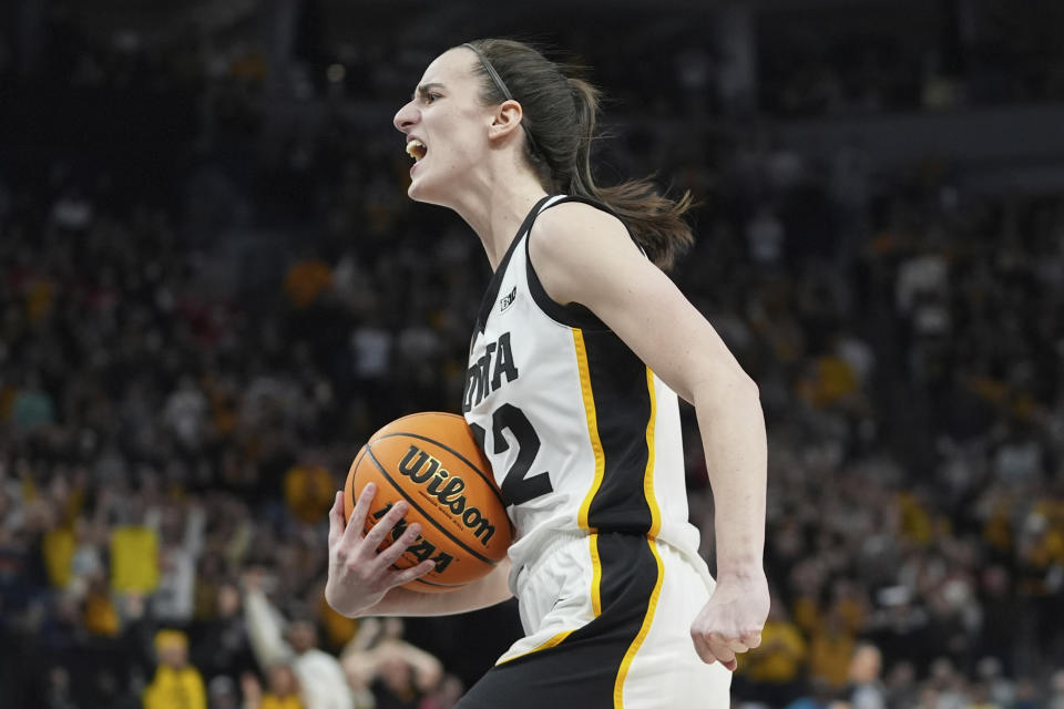 Iowa guard Caitlin Clark celebrates as time expires during the overtime win of an NCAA college basketball game against Nebraska in the final of the Big Ten women's tournament Sunday, March 10, 2024, in Minneapolis. (AP Photo/Abbie Parr)