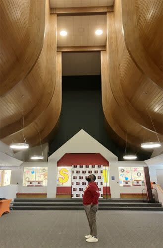 Friendship Aspire Academy Principal Jherrithan Dukes tours the school’s innovation center, a former church sanctuary. The school, which prioritizes hiring Black teachers, is inspiring loyalty among Pine Bluff families. (Greg Toppo/The 74)