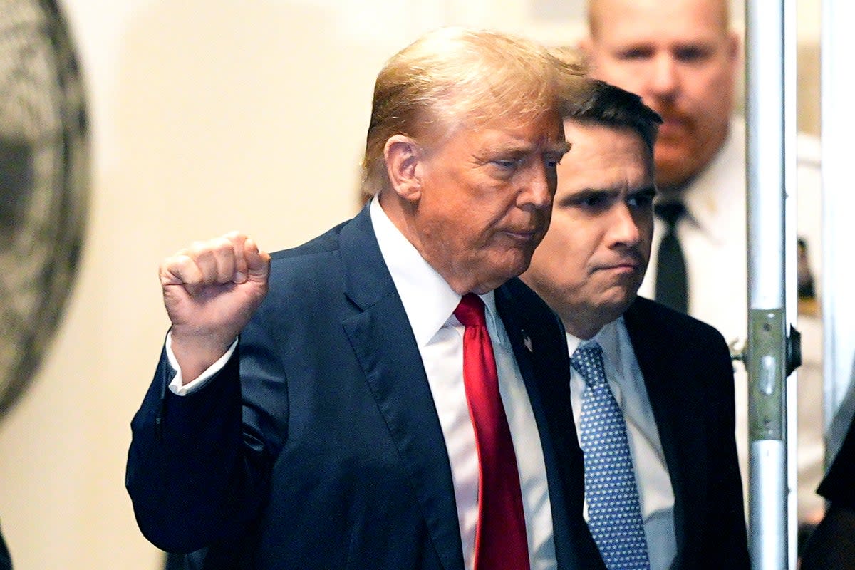 Former President Donald Trump appears outside the courtroom during his trial for allegedly covering up hush money payments at Manhattan Criminal Court on 23 April 2024 (Getty Images)