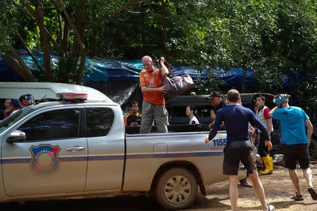 FILE PHOTO: British caver Vernon Unsworth (C) gets out of a pick up truck near the Tham Luang cave complex, where 12 boys and their soccer coach are trapped, in the northern province of Chiang Rai, Thailand, July 5, 2018.REUTERS/Panu Wongcha-um