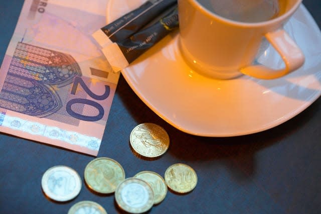 AK998B Coffee Cup and Euros in Paris Cafe