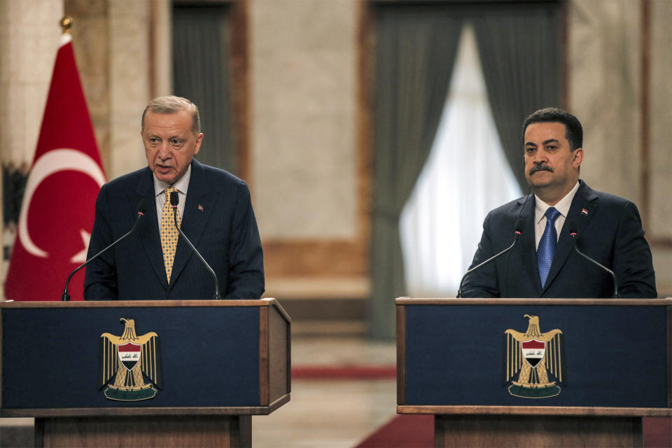 Turkish President Recep Tayyip Erdogan, left and Iraqi Prime Minister Mohammed Shia al-Sudani take part in a press conference, in Baghdad, Iraq, Monday, April 22, 2024. Erdogan arrived in Iraq on Monday for his first official visit in more than a decade. (Ahmad Al-Rubaye /Pool Photo via AP)