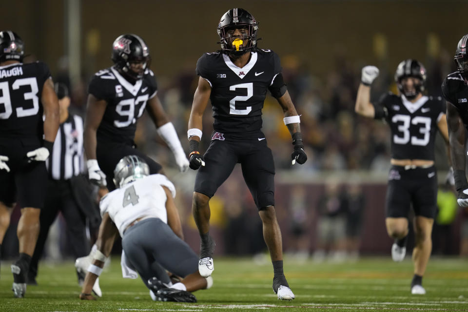 Minnesota defensive back Tre'Von Jones (2) celebrates after sacking Eastern Michigan quarterback Austin Smith (4) during the second half of an NCAA college football game Saturday, Sept. 9, 2023, in Minneapolis. (AP Photo/Abbie Parr)