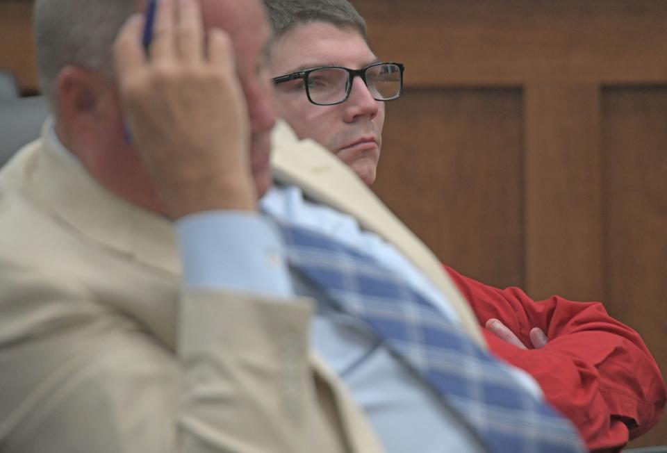 Stonie Butler and his attorney Josh Brown listen to a witness testify Tuesday morning during Butler's child rape case in Judge Phil Naumoff's courtroom.