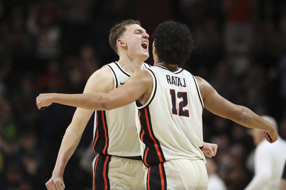 Oregon State forward Michael Rataj, right, celebrates his 3-pointer gainst Oregon with forward Tyler Bilodeau during the second half of an NCAA college basketball game Saturday, Feb. 17, 2024, in Corvallis, Ore. Oregon won 60-58. (AP Photo/Amanda Loman)