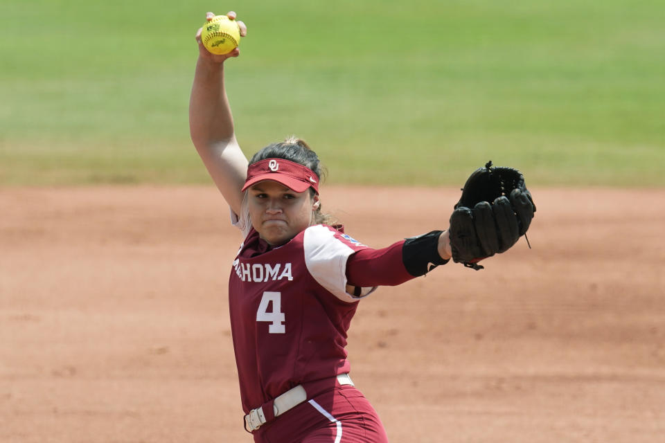 Oklahoma's Shannon Saile pitches in the first inning of an NCAA Women's College World Series softball game against James Madison, Sunday, June 6, 2021, in Oklahoma City. (AP Photo/Sue Ogrocki)