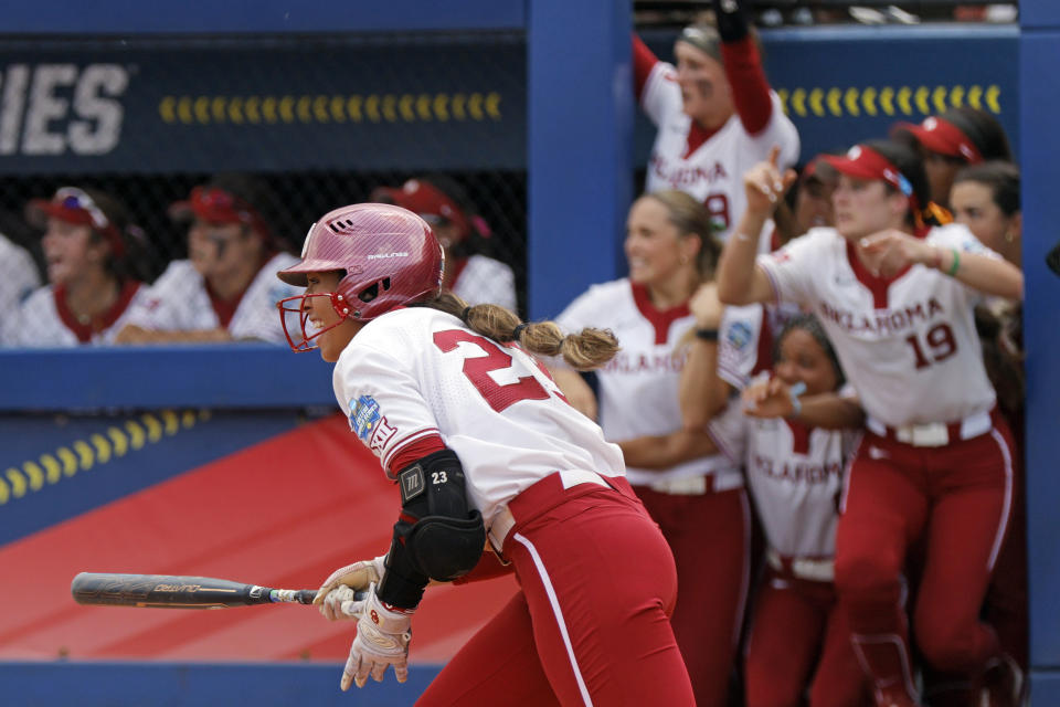 Oklahoma's Tiare Jennings runs after hitting a 2-RBI double during the ninth inning of an NCAA softball Women's College World Series game against Stanford, Monday, June 5, 2023, in Oklahoma City. (AP Photo/Nate Billings)