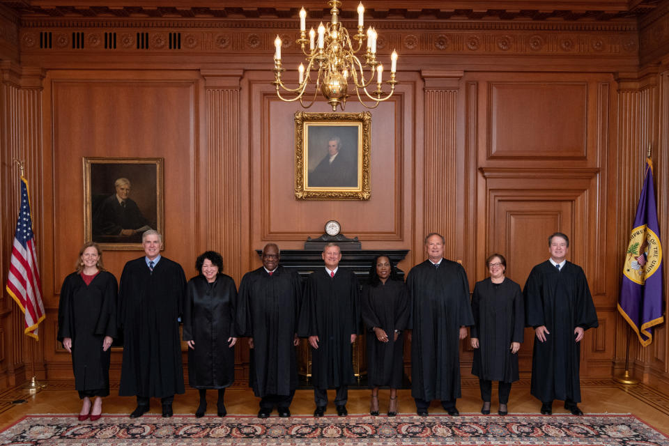 U.S. Supreme Court justices pose prior to Ketanji Brown Jackson's investiture ceremony at the Supreme Court in Washington, D.C., on Friday. 