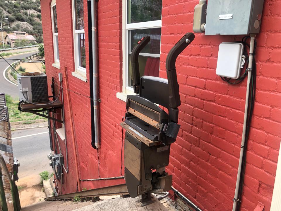 A chair lift on a staircase in Bisbee.