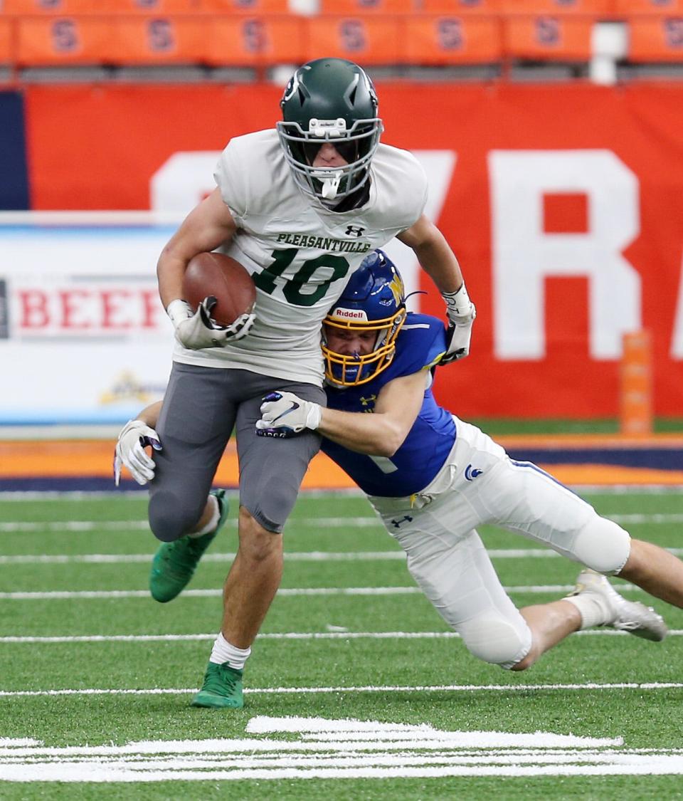 Pleasantville's Danielo Picard (10) looks for some running room in the Maine-Endwell defense during the Class B state football championship game in the Carrier Dome at Syracuse University on Sautrday. Maine-Endwell won the game 21-12.