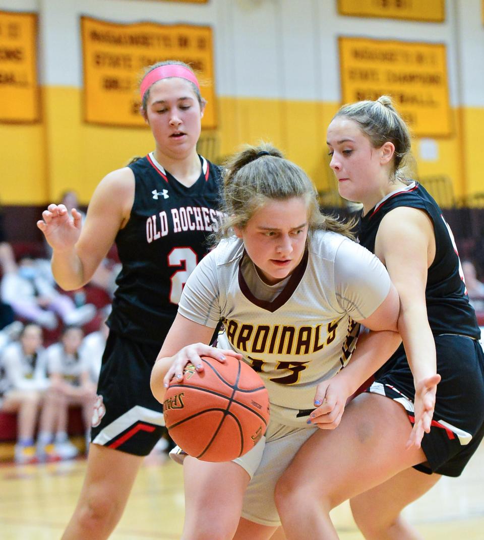 Case’s Liberty Gazaille splits Old Rochester’s Hannah Thorell and Emma Johnson during a recent game.