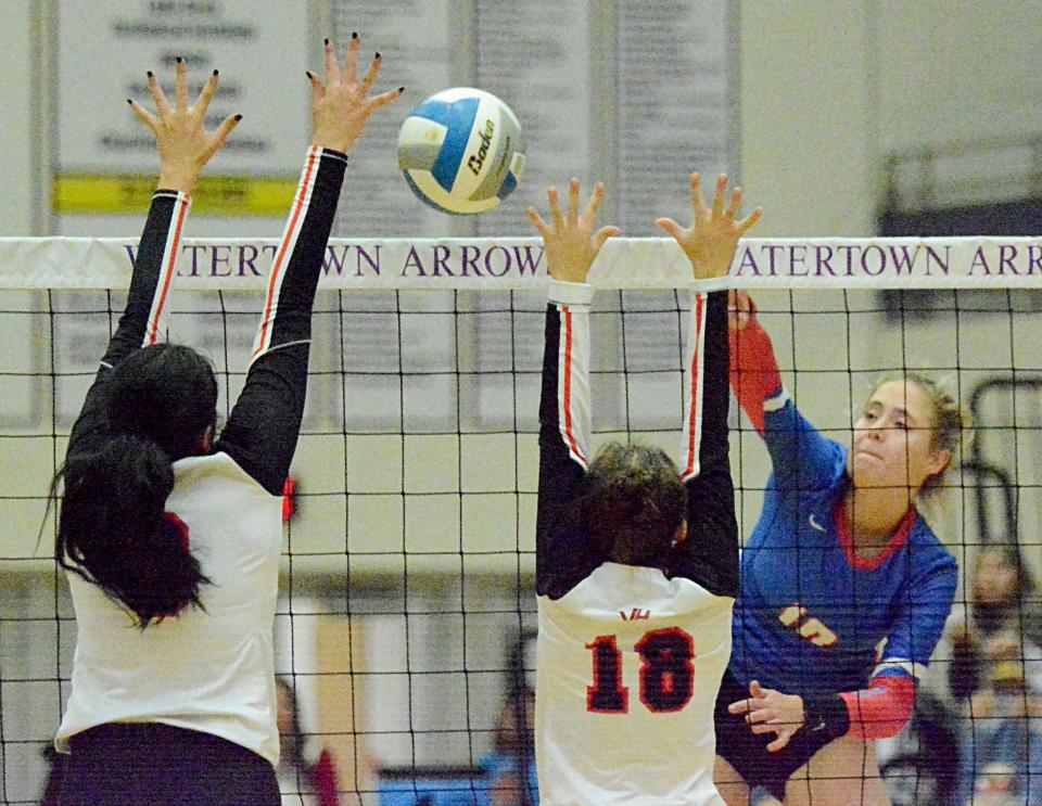 Warner's Lauren Marcuson spikes the ball against Viborg-Hurley's Denae Mach and Kennedy Schwartz during their SoDak 16 Class B state-qualifying volleyball match on Tuesday, Nov. 8, 2022 in the Watertown Civic Arena.