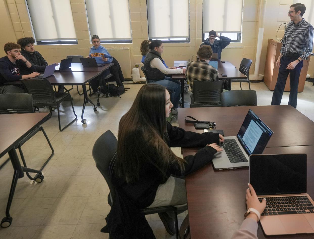 Marquette students in an education class work on their assignments. Artificial intelligence is changing the way students learn and instructors teach.