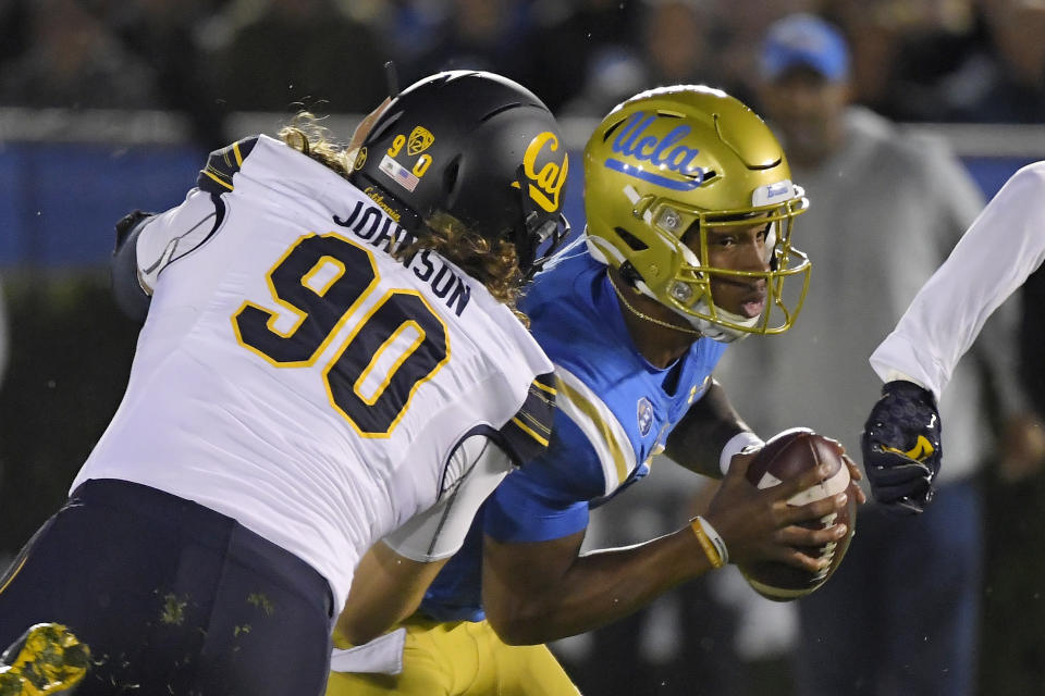 California nose tackle Brett Johnson, left, sacks UCLA quarterback Dorian Thompson-Robinson during the first half of an NCAA college football game Saturday, Nov. 30, 2019, in Pasadena, Calif. (AP Photo/Mark J. Terrill)