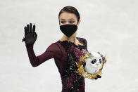 Gold medalist, Anna Shcherbakova, of the Russian Olympic Committee, poses after the women's free skate program during the figure skating competition at the 2022 Winter Olympics, Thursday, Feb. 17, 2022, in Beijing. (AP Photo/Natacha Pisarenko)