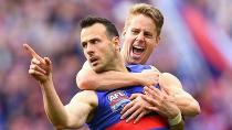 Tory Dickson of the Bulldogs is congratulated by Lachie Hunter after kicking a goal. Pic: Getty