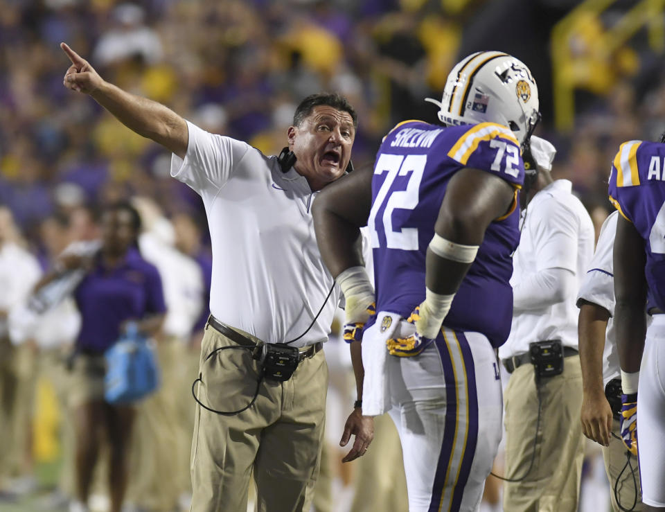 LSU head coach Ed Orgeron instructs nose tackle Tyler Shelvin (72) in the first half of an NCAA football game against Northwestern State Saturday in Baton Rouge, La., Sept. 14, 2019. (AP Photo/Patrick Dennis)