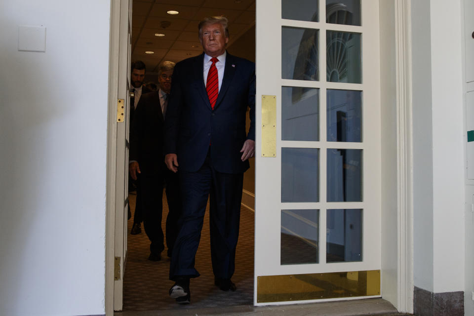 President Donald Trump arrives for an event to honor the 2019 Stanley Cup Champion St. Louis Blues, in the Rose Garden of the White House, Tuesday, Oct. 15, 2019, in Washington. (AP Photo/Evan Vucci)