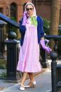 <p>The actress wore an interesting ensemble as Carrie Bradshaw, in a gingham dress, headscarf and purple rubber gloves. </p>