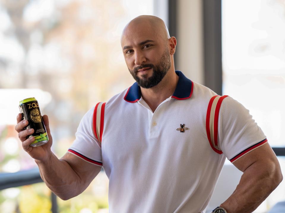 strength and conditioning coach Dave Rienzi holding a can of ZOA energy drink