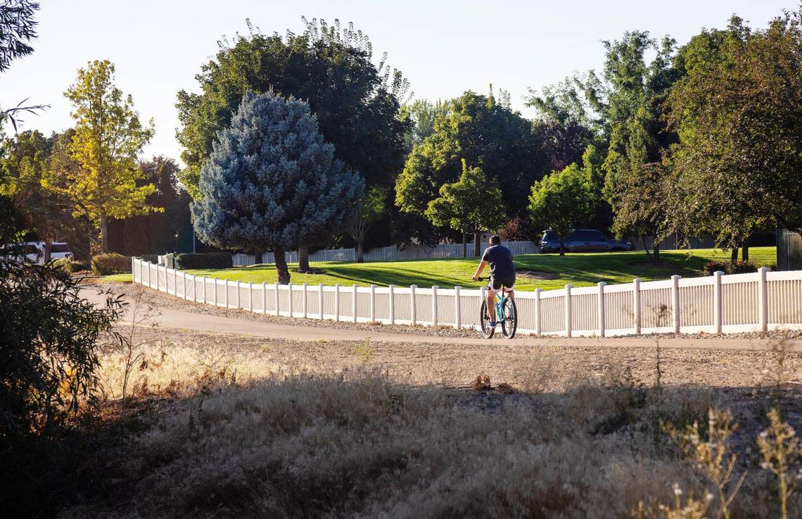 A cyclist moves along the Five Mile Pathway that runs from the Boise/Meridian boundary to Can Ada Road.