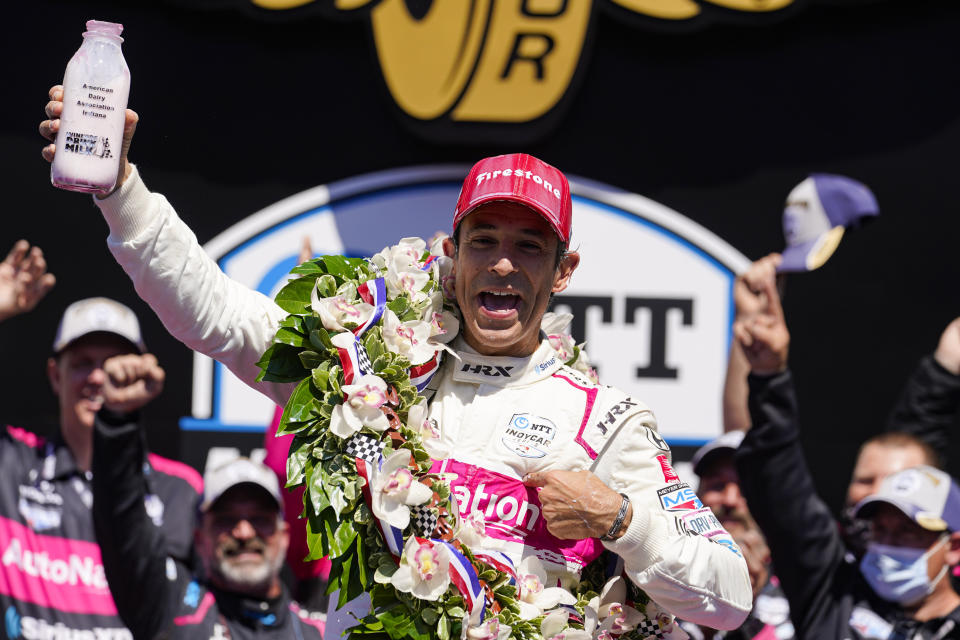 Helio Castroneves of Brazil celebrates after winning the Indianapolis 500 auto race at Indianapolis Motor Speedway in Indianapolis, Sunday, May 30, 2021. (AP Photo/Michael Conroy)