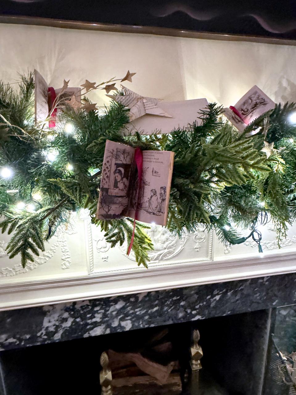 A mantel featuring decorations made to look like books is shown at the White House.