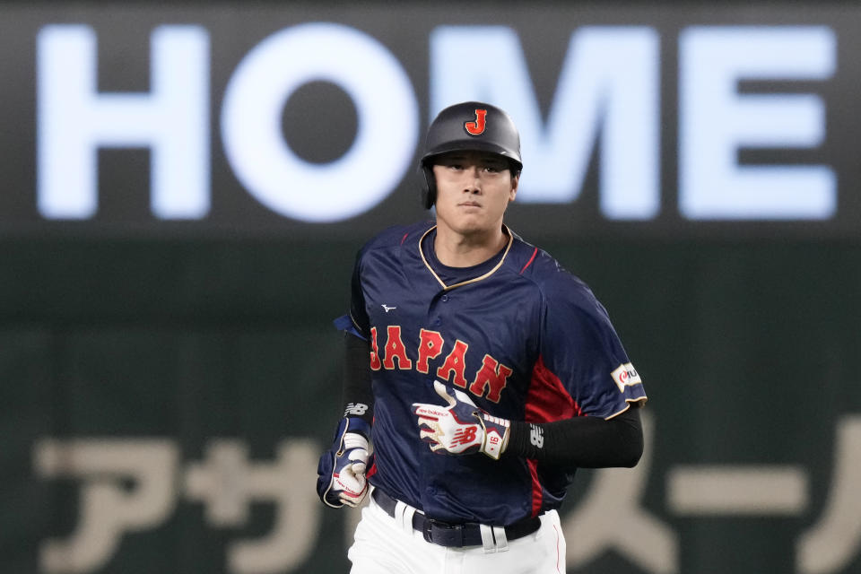 Shohei Ohtani of Japan rounds the bases after hitting a 3-run home run in the 1rst inning against Australia during their Pool B game at the World Baseball Classic at the Tokyo Dome Sunday, March 12, 2023, in Tokyo. (AP Photo/Eugene Hoshiko)