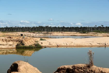 A view shows deforestation caused by illegal gold mining, as seen during Peru's President Martin Vizcarra's visit to Madre de Dios, Peru, May 17, 2019. REUTERS/Guadalupe Pardo