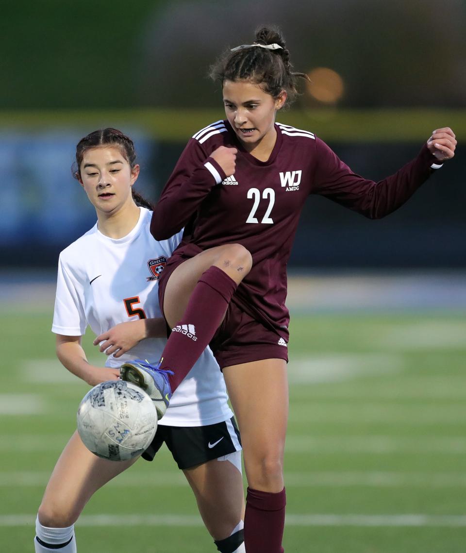 Walsh Jesuit's Lauren Ziemiaski kicks the ball against Green's Lauren Leemaster during the first half of a Division I district championship soccer game at NDCL, Thursday, Oct. 27, 2022, in Chardon, Ohio.