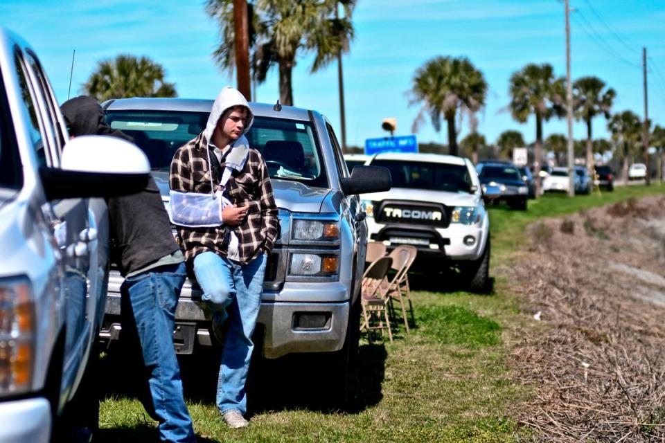 Anthony Cook leans against a truck near Archers Creek where crews were searching for his girlfriend, Mallory Beach, around noon on Monday, Feb. 25, 2019. The couple was on board a boat early Sunday morning when it crashed near the bridge leading onto Parris Island.