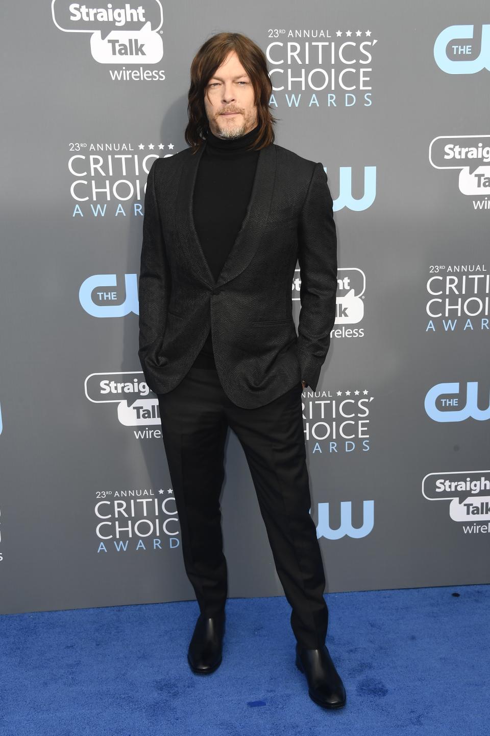 Norman Reedus in Ermenegildo Zegna Couture with Christian Louboutin shoes and a Rolex watch