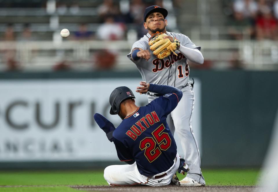 Twins center fielder Byron Buxton is out at second base as Tigers second baseman Isaac Paredes turns a double play in the first inning on Tuesday, Sept. 28, 2021, in Minneapolis.