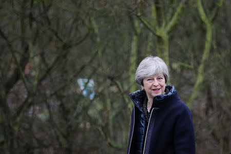 Britain's Prime Minister Theresa May walks through the Wildfowl and Wetland Trust's (WWT) grounds ahead of a speech to launch the government's environment plan at the London Wetland Centre in west London, Britain, January 11, 2018. REUTERS/Dan Kitwood/Pool