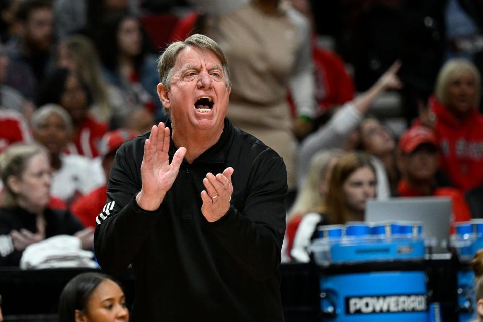 Mar 31, 2024; Portland, OR, USA; NC State Wolfpack head coach Wes Moore reacts during the first half against theTexas Longhorns in the finals of the Portland Regional of the NCAA Tournament at the Moda Center center. Mandatory Credit: Troy Wayrynen-USA TODAY Sports