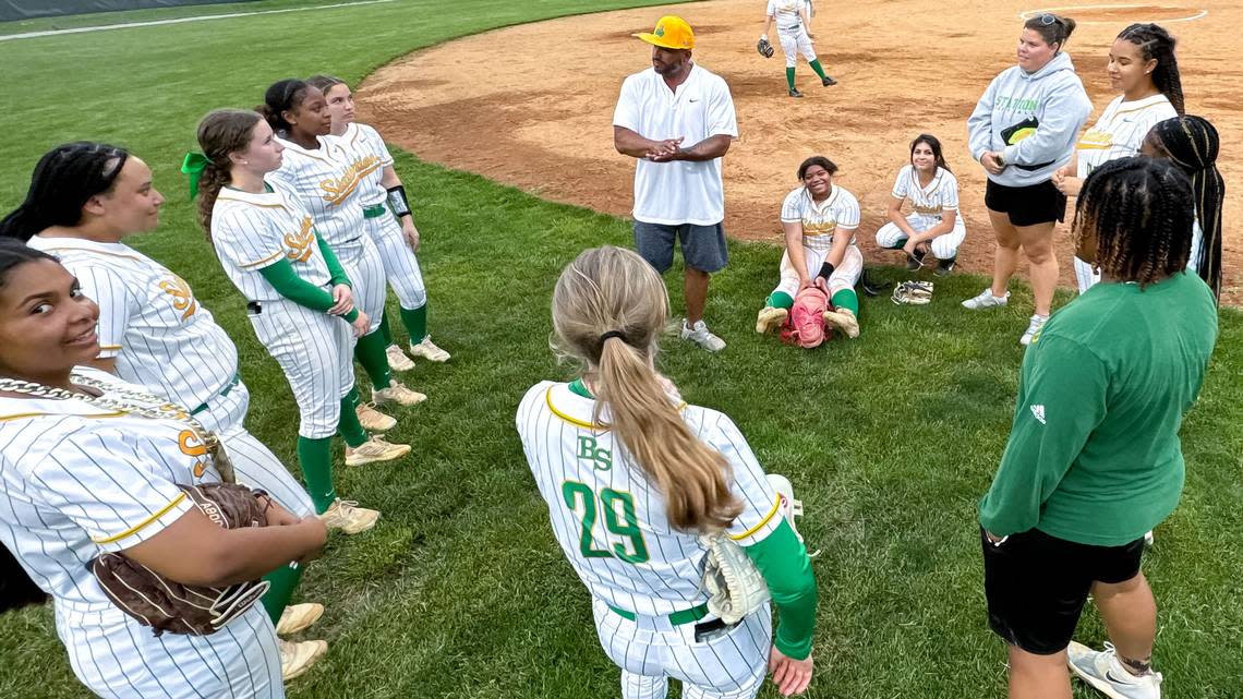 Bryan Station coach Hector Urbaneja, center, spoke to his team after the Defenders defeated Taylor County at Bryan Station High School on Friday.