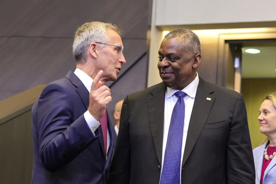 NATO Secretary General Jens Stoltenberg, left, speaks with U.S. Secretary for Defense Lloyd J. Austin III during a meeting of the North Atlantic Council in defense ministers format at NATO headquarters in Brussels, Thursday, Oct. 13, 2022. NATO Defense Ministers are convening in Brussels for the second day of talks to assess the situation in Ukraine, as the alliance committed on Wednesday to deliver more air defense supply to the country. (AP Photo/Olivier Matthys)