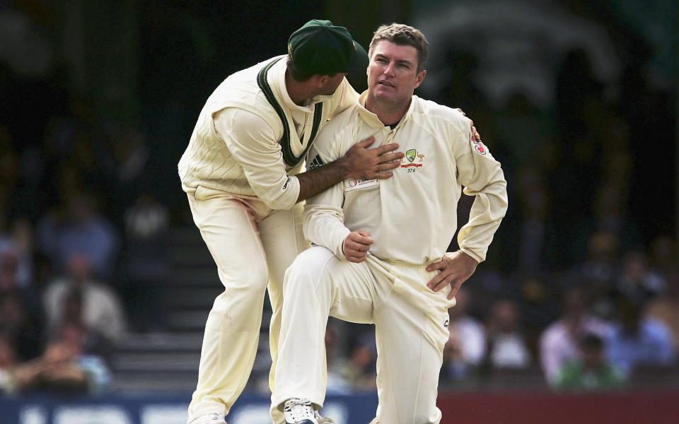 Stuart MacGill of Australia is congratulated by Ricky Ponting after taking the wicket of Steven Harmison of the ICC World XI during day four of the Johnnie Walker Super Series Test between Australia and the ICC World XI played at the Sydney Cricket Ground on October 17, 2005 in Sydney - GETTY IMAGES