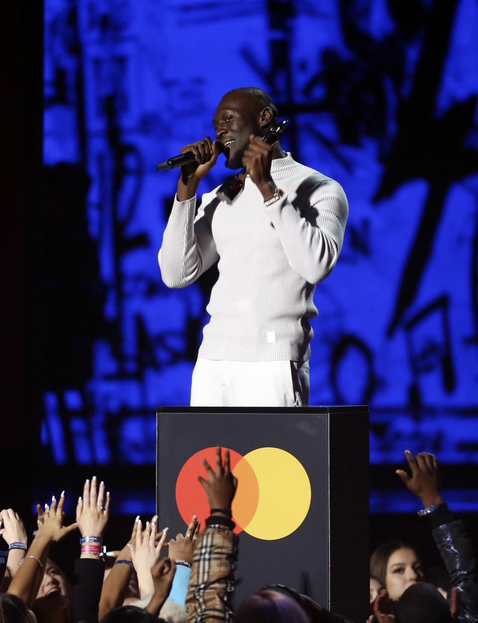 Stormzy accepts his award for Male Solo Artist of the Year on stage at the Brit Awards 2020 in London, Tuesday, Feb. 18, 2020. (Photo by Joel C Ryan/Invision/AP)